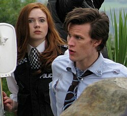 Karen Gillan (as Amy Pond) and Matt Smith (the Eleventh Doctor) on set for Doctor Who ("The Eleventh Hour"). Popular franchises such as Doctor Who have inspired numerous fan fiction stories written mostly by young female authors.