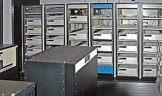 The master atomic clock ensemble at the U.S. Naval Observatory in Washington, D.C., which provides the time standard for the U.S. Department of Defense.[1] The rack-mounted units in the background are HP 5071A caesium beam clocks. The black units in the foreground are Sigma-Tau MHM-2010 hydrogen maser standards.