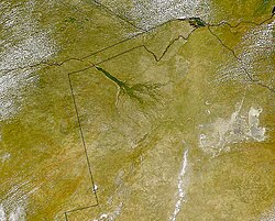 The Okavango Delta (centre) of southern Africa, where the Okavango River spills out into the empty trough of the Kalahari Desert. The area was a lake fed by the river during the Ice Ages (national borders are superimposed).