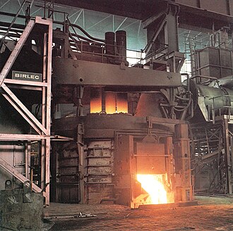 An electric arc furnace during operation, c. 1975