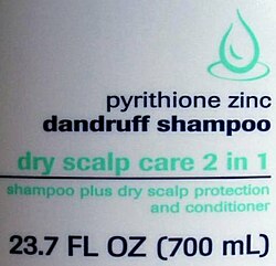A 23.7 US fl oz (700 mL) bottle displaying both U.S. and metric units