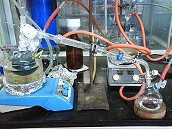 After being refluxed with sodium and benzophenone to remove oxygen and water, toluene is distilled under inert gas into a receiving flask.