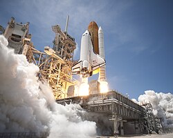Rockets, like the Space Shuttle Atlantis, expel mass during operation. This means that the mass being pushed, the rocket and its remaining onboard fuel supply, is constantly changing.