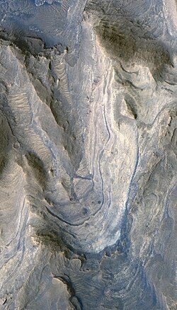 Layers of phyllosilicates and sulfates exposed in sediment mound within Gale Crater (HiRISE).