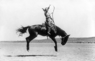 Kitty Canutt, champion lady rider of the world, on Winnemucca, 1919